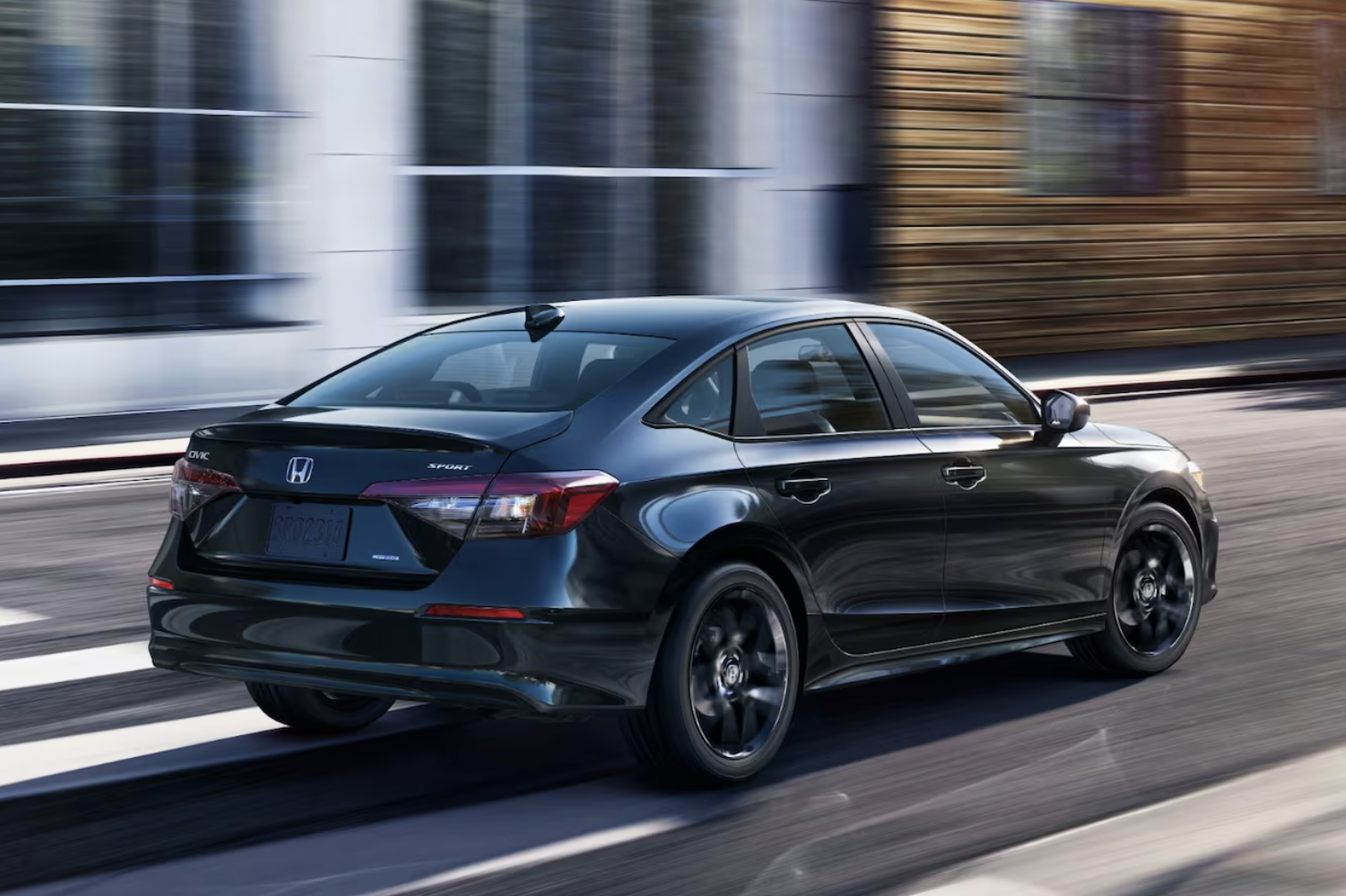2025 Honda Civic Sport driving on city road