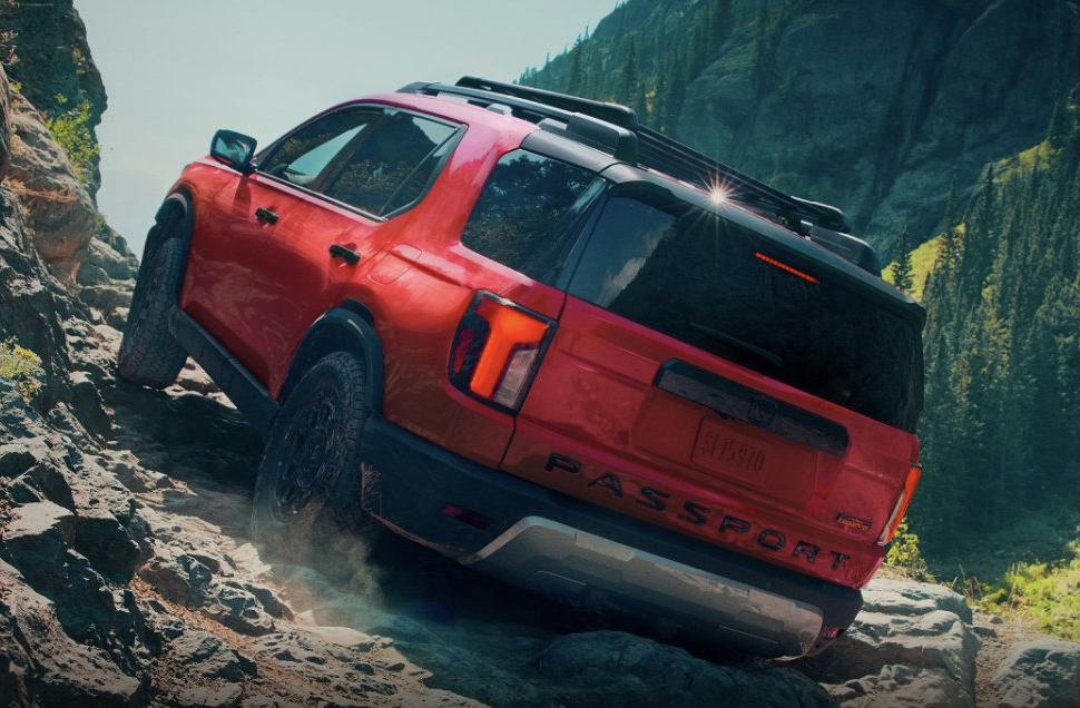 a 2026 Honda Passport Trailsport elite driving on a mountain road